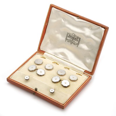 Lot 315 - An Art Deco gold and mother of pearl dress stud set