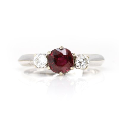 Lot 182 - A white gold ruby and diamond three stone ring