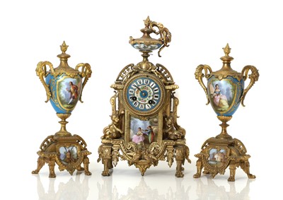 Lot 219 - A Louis XVI style gilt metal clock garniture