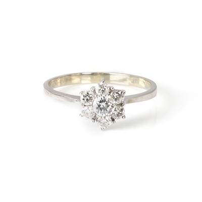Lot 111 - A white gold diamond daisy cluster ring
