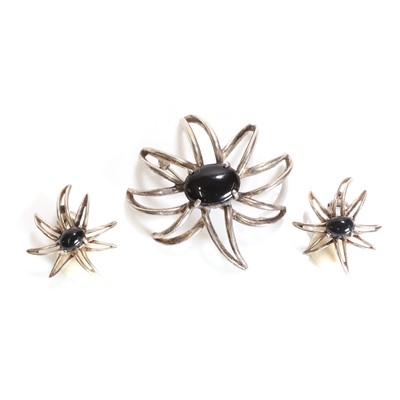 Lot 225 - A silver and onyx 'Fireworks' brooch and earring set, by Tiffany and Co.