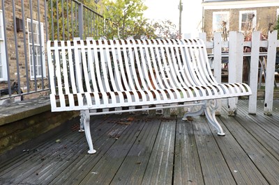 Lot 435 - A cast iron and strapwork garden seat