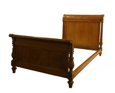 Lot 626 - A French Directoire style beechwood bed