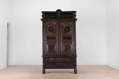 Lot 355 - A Breton carved walnut and fruitwood cupboard