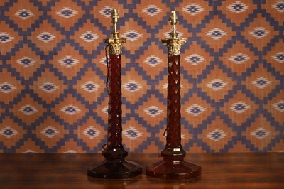 Lot 525 - A pair of red glass table lamps