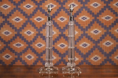 Lot 554 - A pair of facet cut glass table lamps