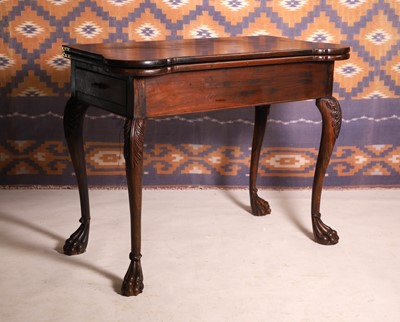 Lot 527 - A George II style hardwood games table