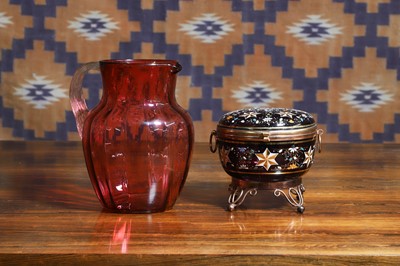 Lot 521 - A Victorian cranberry glass jug
