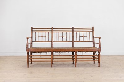 Lot 229 - A late Victorian Aesthetic period walnut bench
