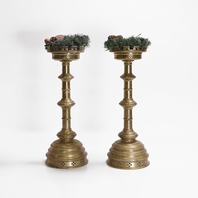 Lot 77 - A pair of brass altar candlesticks