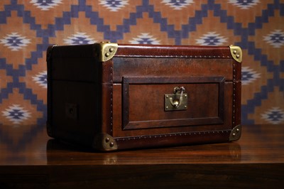 Lot 645 - A patinated leather trunk