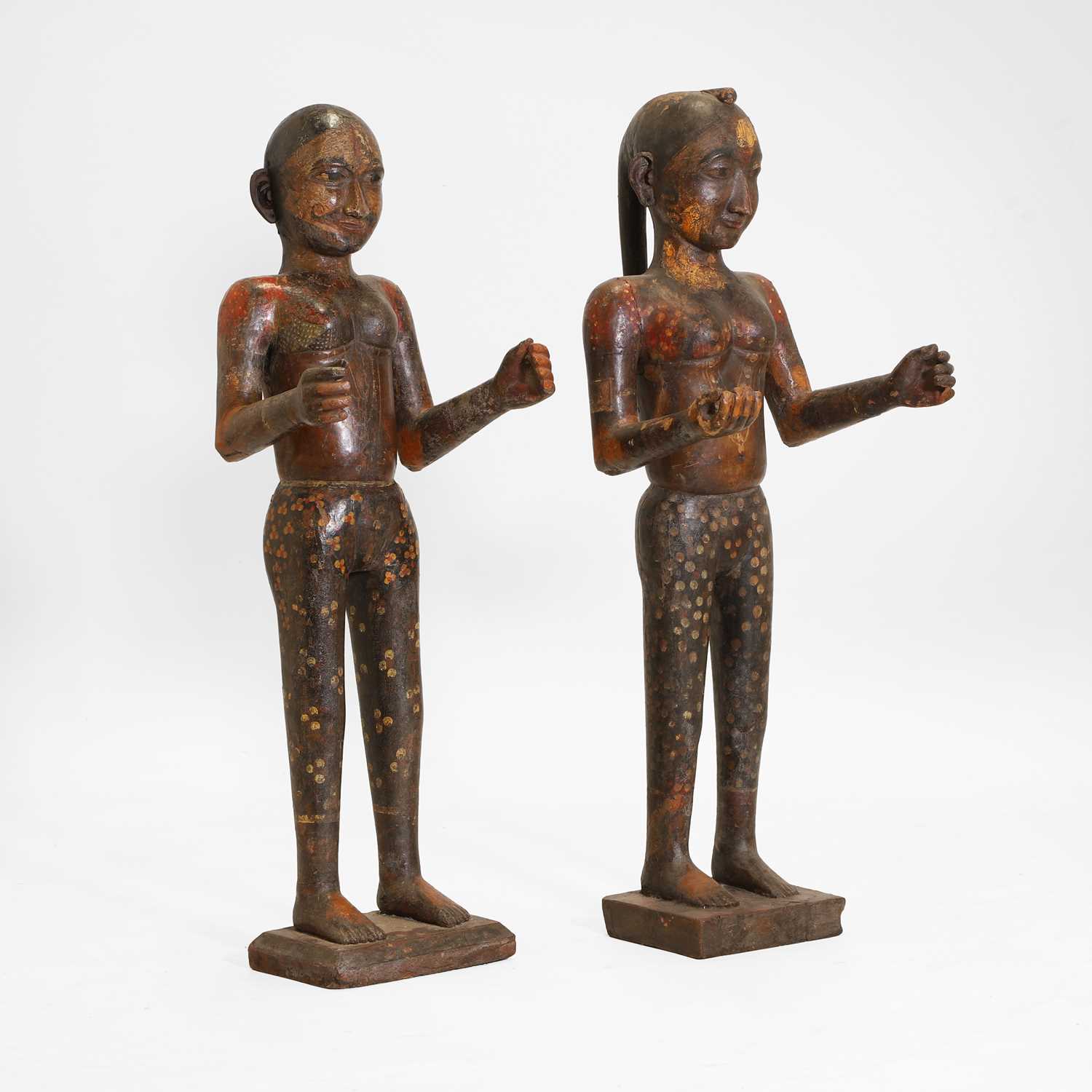 Lot 15 - A pair of carved wooden and painted marriage figures