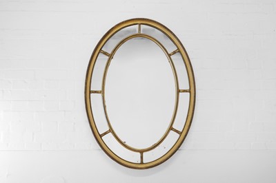 Lot 487 - A George III-style giltwood and gesso oval mirror