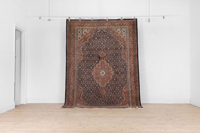 Lot 301 - A wool rug of Persian Bidjar design