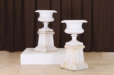 Lot 703 - A pair of painted cast iron campana garden urns