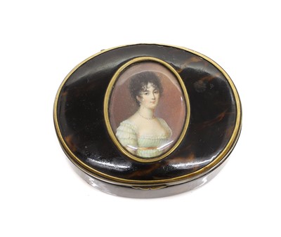 Lot 132 - A tortoiseshell and brass mounted oval snuff box