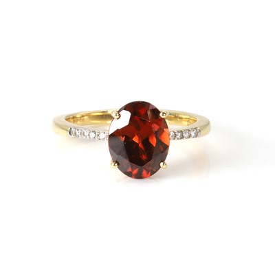 Lot 135 - An 18ct gold red zircon and diamond ring