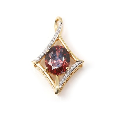 Lot 138 - An 18ct gold red zircon and diamond pendant