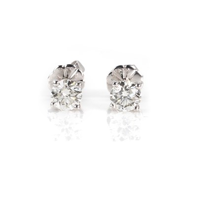 Lot 97 - A pair of single stone diamond stud earrings