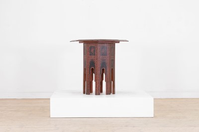 Lot 173 - A black and red lacquered wooden occasional table
