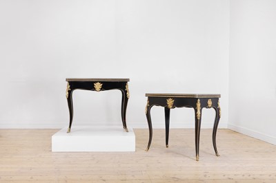 Lot 565 - A pair of Louis XV-style ebonised wooden card tables