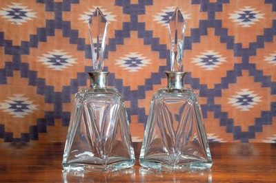 Lot 634 - A pair of Art Deco cut glass decanters