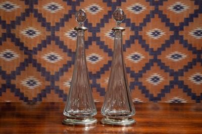 Lot 601 - A pair of silver mounted cut glass decanters