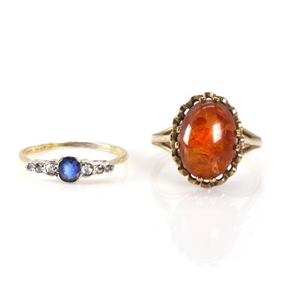 Lot 259 - A sapphire and diamond ring and a 9ct gold amber ring