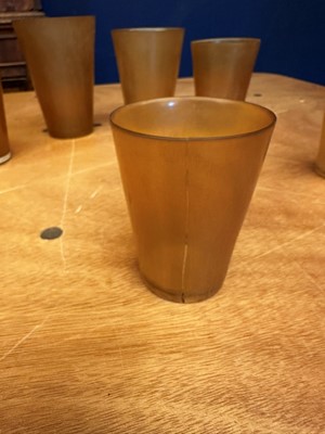 Lot 544 - A leather cased set of six horn stirrup cups