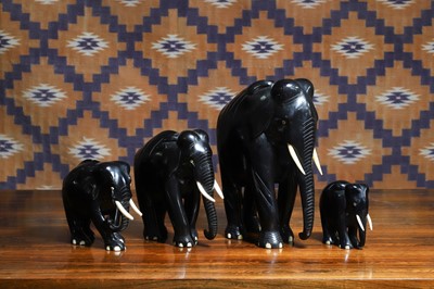 Lot 655 - A group of four Indian ebony elephant figures
