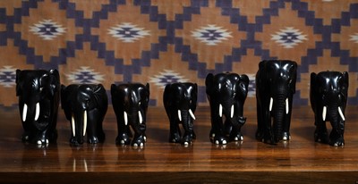 Lot 710 - A group of seven Indian ebony elephant figures