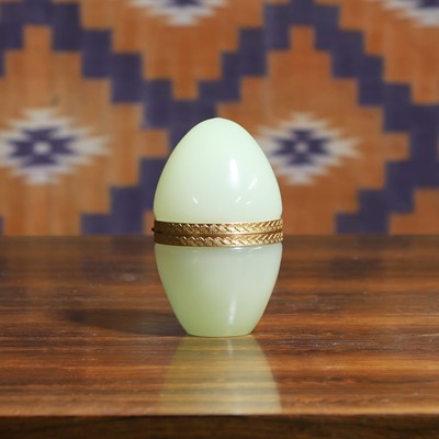 Lot 570 - A Murano lemon yellow egg shaped box