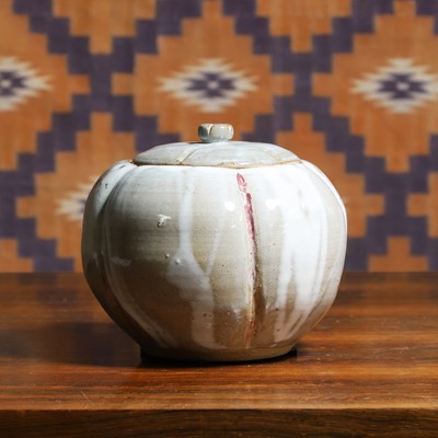 Lot 699 - A studio pottery pumpkin vase and cover