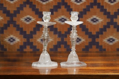 Lot 610 - A pair of rock crystal candlesticks