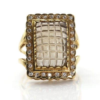 Lot 185 - A carved smoky quartz and diamond cluster ring
