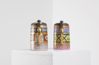 Lot 423 - A pair of Vienna porcelain and gilt-metal-mounted tankards