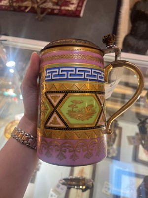 Lot 423 - A pair of Vienna porcelain and gilt-metal-mounted tankards