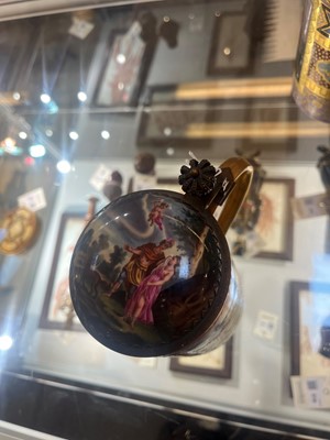 Lot 423 - A pair of Vienna porcelain and gilt-metal-mounted tankards