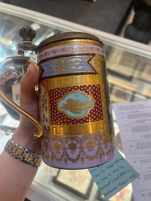 Lot 423 - A pair of Vienna porcelain and gilt-metal-mounted tankards