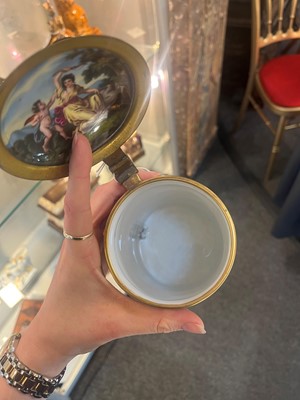Lot 423 - A pair of Vienna porcelain and gilt-metal-mounted tankards