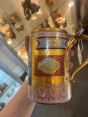 Lot 423 - A pair of Vienna porcelain and gilt-metal-mounted tankards