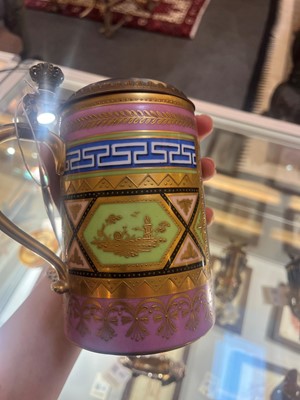 Lot 423 - A pair of Vienna porcelain and gilt-metal-mounted tankards