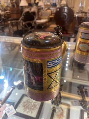 Lot 423 - A pair of Vienna porcelain and gilt-metal-mounted tankards