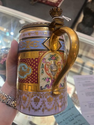 Lot 423 - A pair of Vienna porcelain and gilt-metal-mounted tankards
