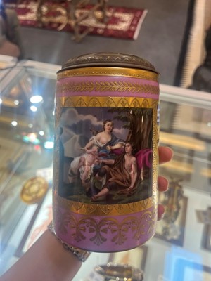 Lot 423 - A pair of Vienna porcelain and gilt-metal-mounted tankards