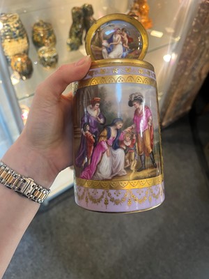 Lot 423 - A pair of Vienna porcelain and gilt-metal-mounted tankards
