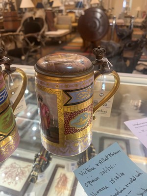 Lot 423 - A pair of Vienna porcelain and gilt-metal-mounted tankards