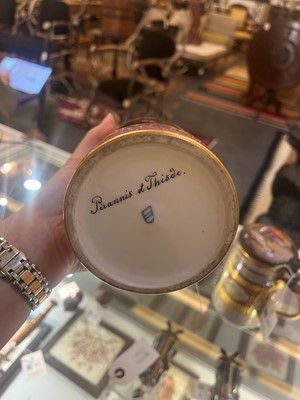 Lot 423 - A pair of Vienna porcelain and gilt-metal-mounted tankards