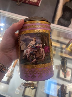 Lot 423 - A pair of Vienna porcelain and gilt-metal-mounted tankards