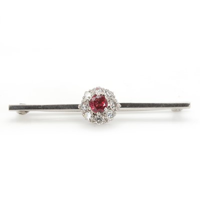 Lot 93 - An 18ct white gold ruby and diamond cluster bar brooch